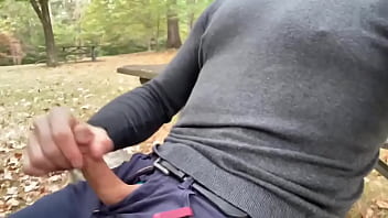 Tjenner pulling his pecker and jerking off on the picnic table and cumming. He talks in this and has a really hard cock.