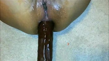 Giant black dildo in oiled fat ass
