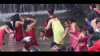 group bath in river nepal